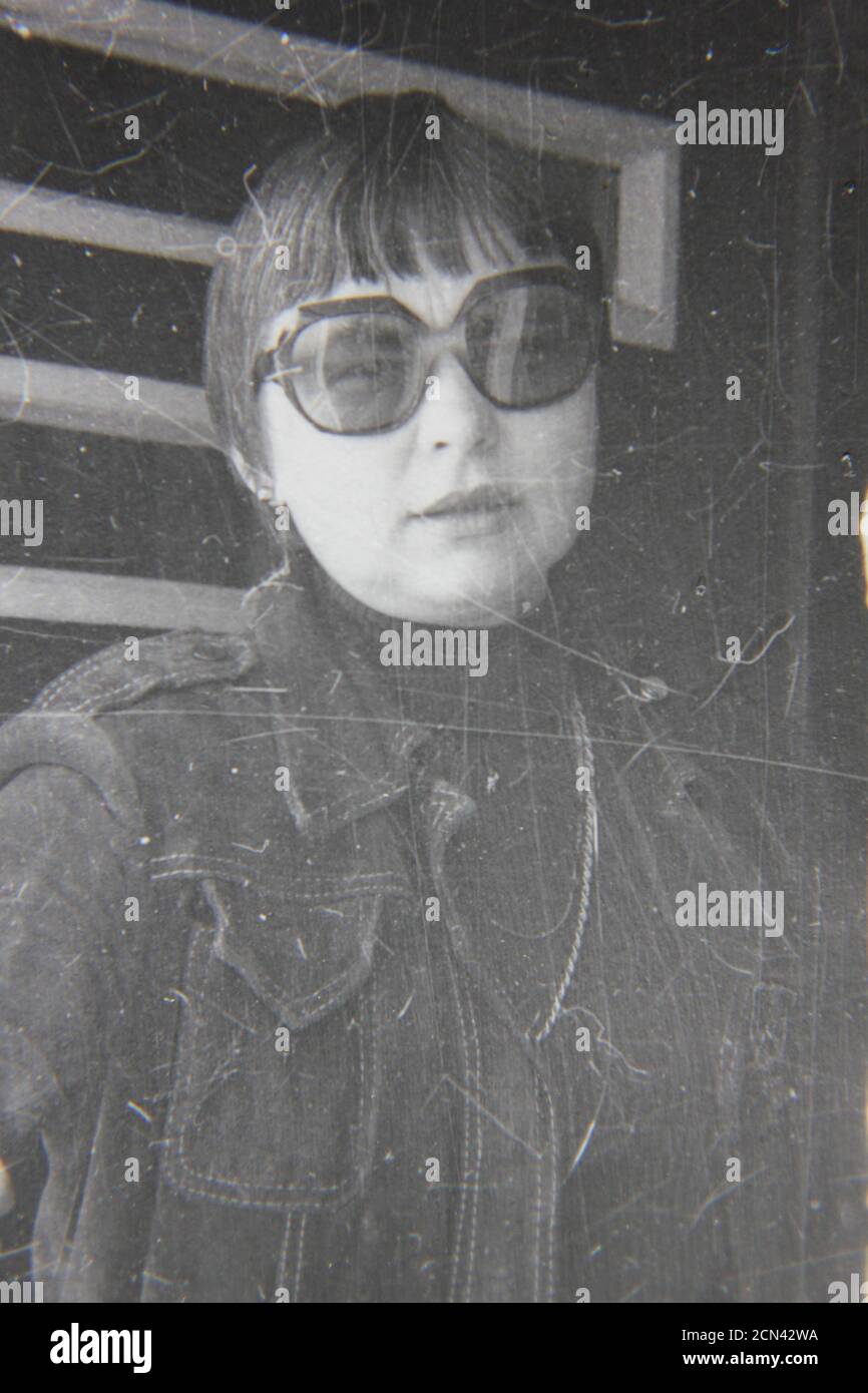 Fine 1970s vintage black and white photography of a woman glaring a the