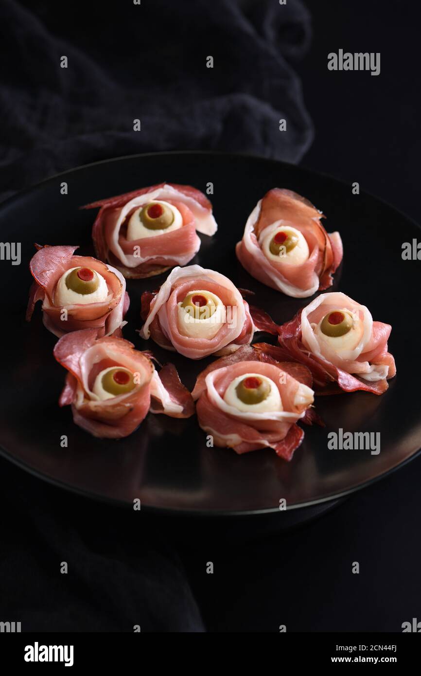 Original Halloween snacks. Eyeballs cooked from ham with mozzarella ...