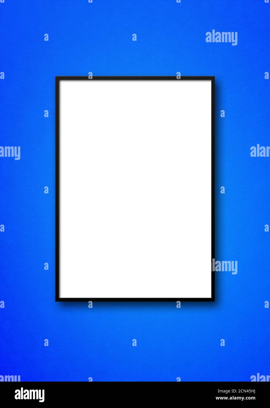 Black picture frame hanging on a blue wall Stock Photo - Alamy