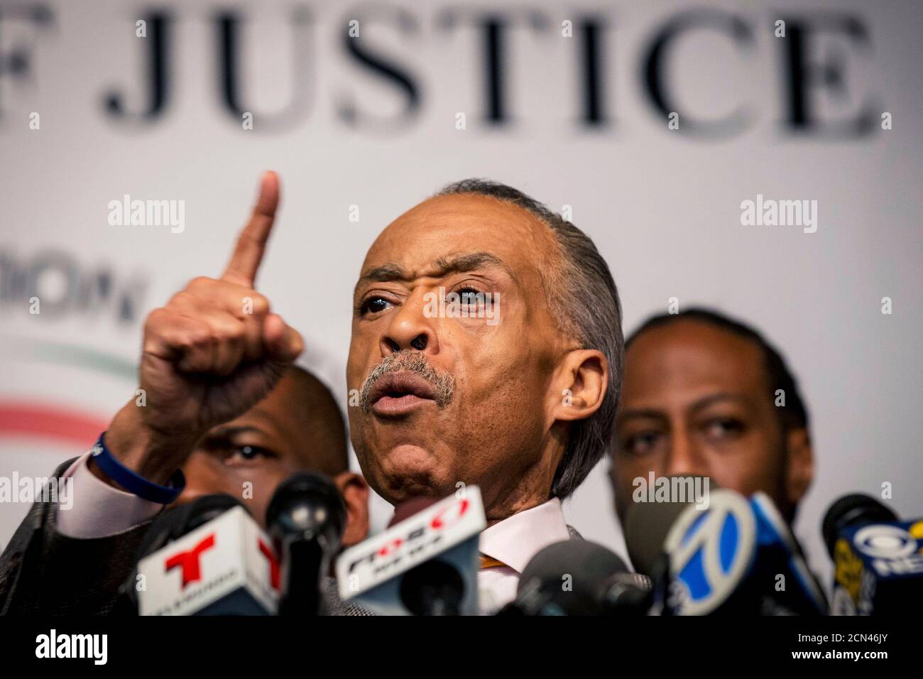 Civil rights activist Al Sharpton (C) speaks during a news conference at the National Action Network in Harlem, New York December 4, 2014. Sharpton and civil rights leaders hold a press conference the day after thousands of demonstrators blocked streets, snarling New York City traffic into early Thursday morning, after a grand jury decided not to charge a white police officer for causing the death of an unarmed black man with a chokehold. REUTERS/Brendan McDermid (UNITED STATES - Tags: CIVIL UNREST CRIME LAW POLITICS TPX IMAGES OF THE DAY) Stock Photo