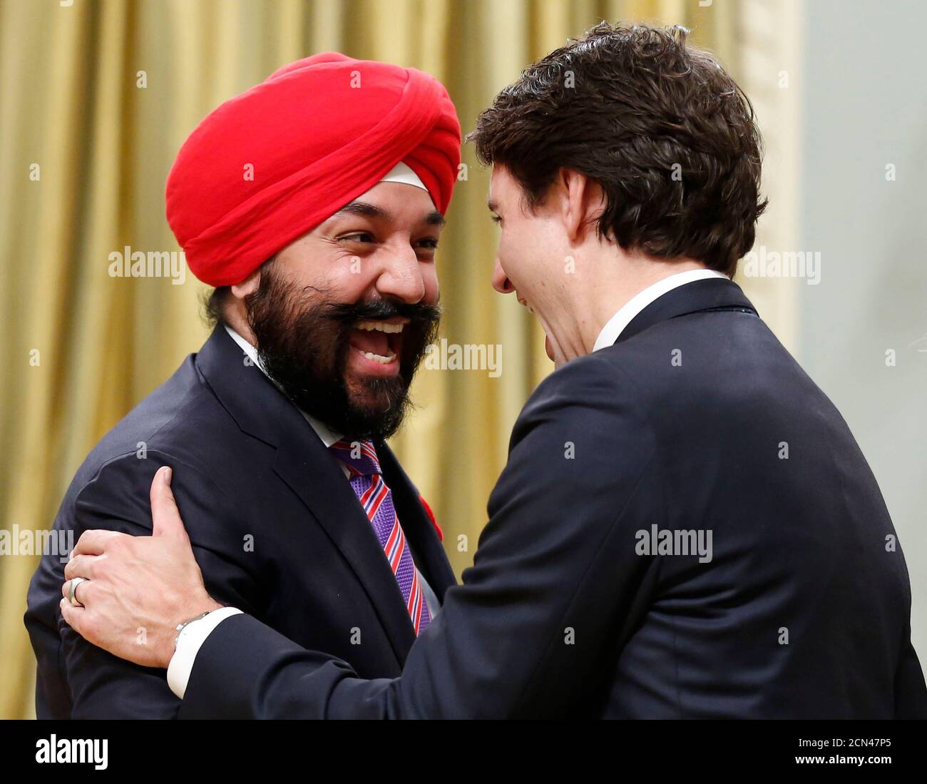Canada's new Innovation, Science and Economic Development Minister Navdeep Bains (L) is congratulated by Prime Minister Justin Trudeau at Rideau Hall in Ottawa November 4, 2015. Morneau's expertise on pension reform will likely also be a significant asset to the newly sworn in Liberal Prime Minister Justin Trudeau, who promised during the election campaign to work with the provinces and businesses to enhance the national pension plan.   REUTERS/Chris Wattie Stock Photo