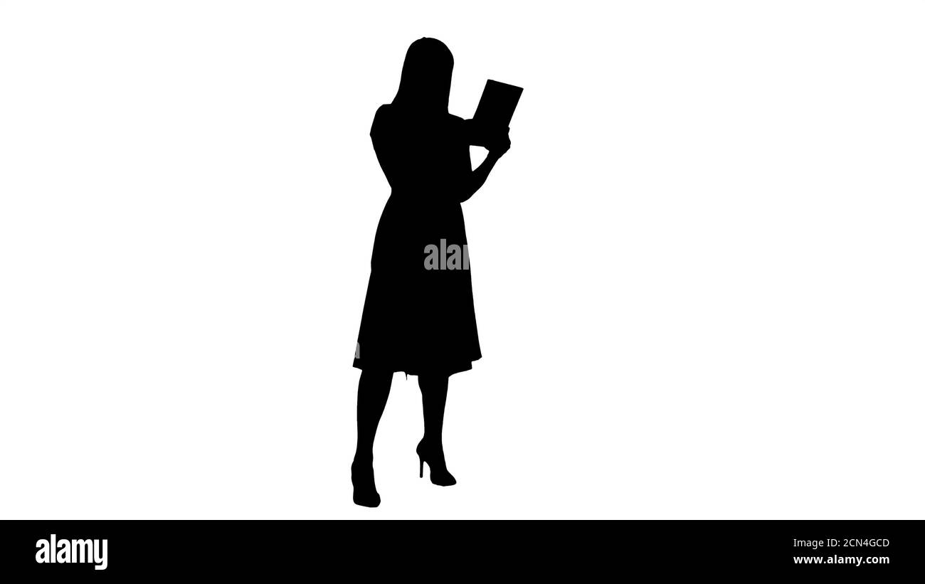 Silhouette Single girl making a video call on her tablet side vi Stock Photo