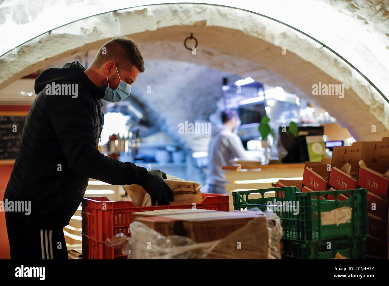 Restaurant owner, Daniele Perrini is seen at his '20mq Panini e Poi' restaurant, in the small southern historical town of Cisternino, Italy, April 5, 2020. Picture taken April 5, 2020. Perrini family have dealt with Italy's strict lockdown measures to combat the spread of the coronavirus disease (COVID-19) with two young daughters studying at home, and owning three restaurants and a bar that can't fully open until June 1. REUTERS/Alessandro Garofalo Stock Photo