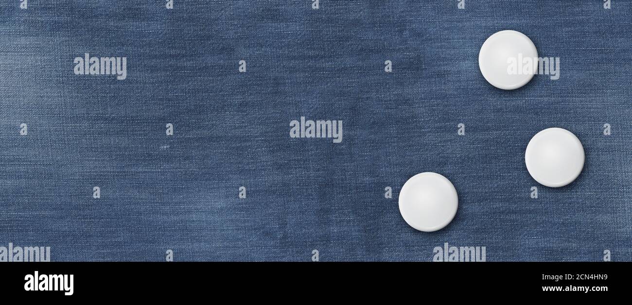 Three badges on a blue denim banner Stock Photo