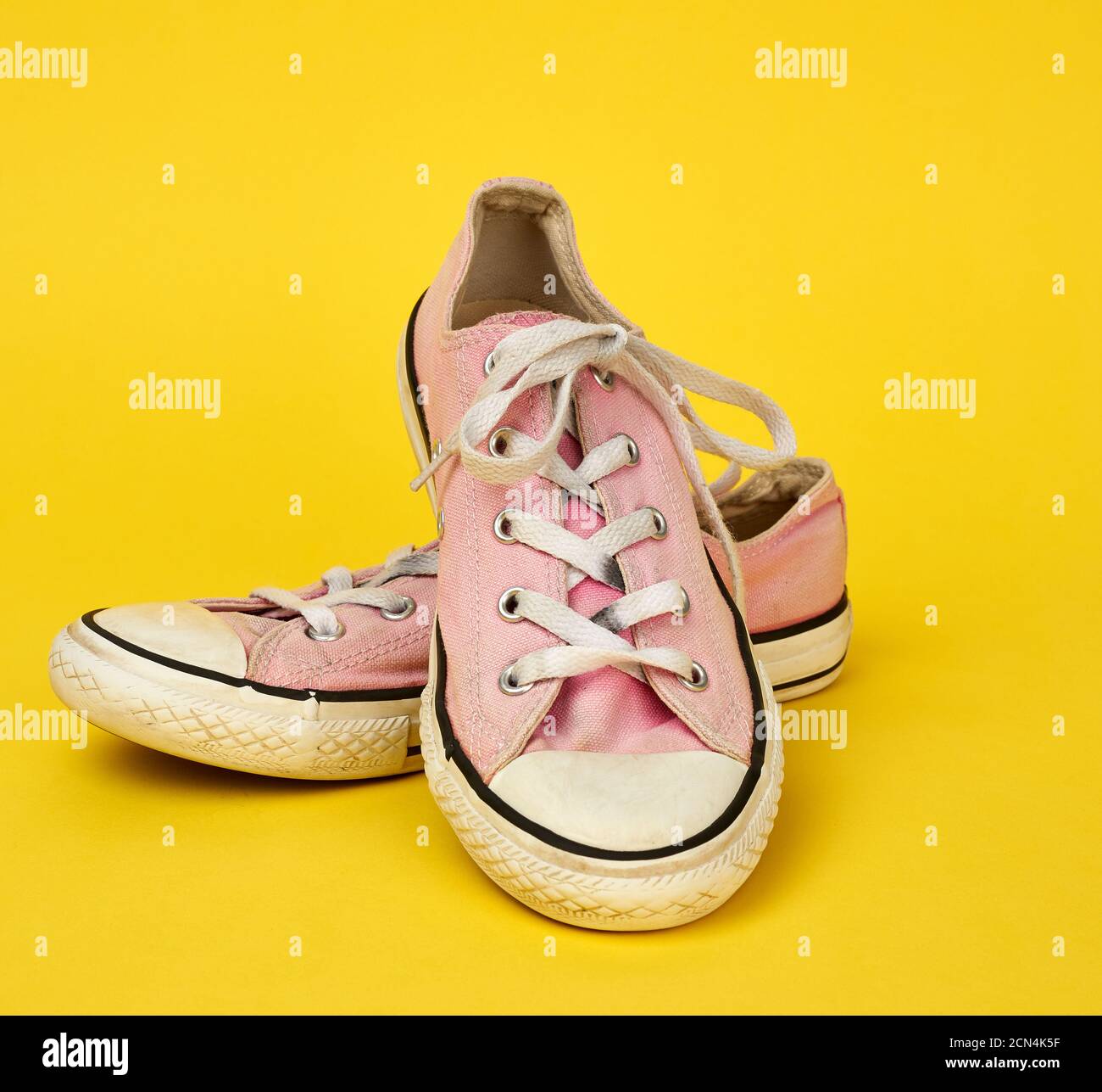 white sneakers with pink soles