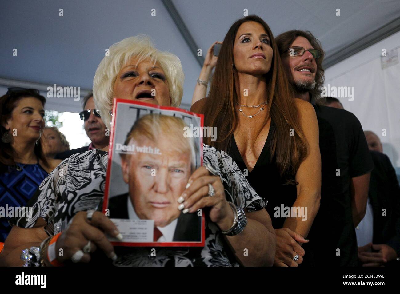 Host Ernie Boch Jr R And His Girlfriend Enza Sambataro C Listen As U S Republican Presidential Candidate Donald Trump Answers Questions From Reporters At A Campaign Fund Raiser At Boch S Home In