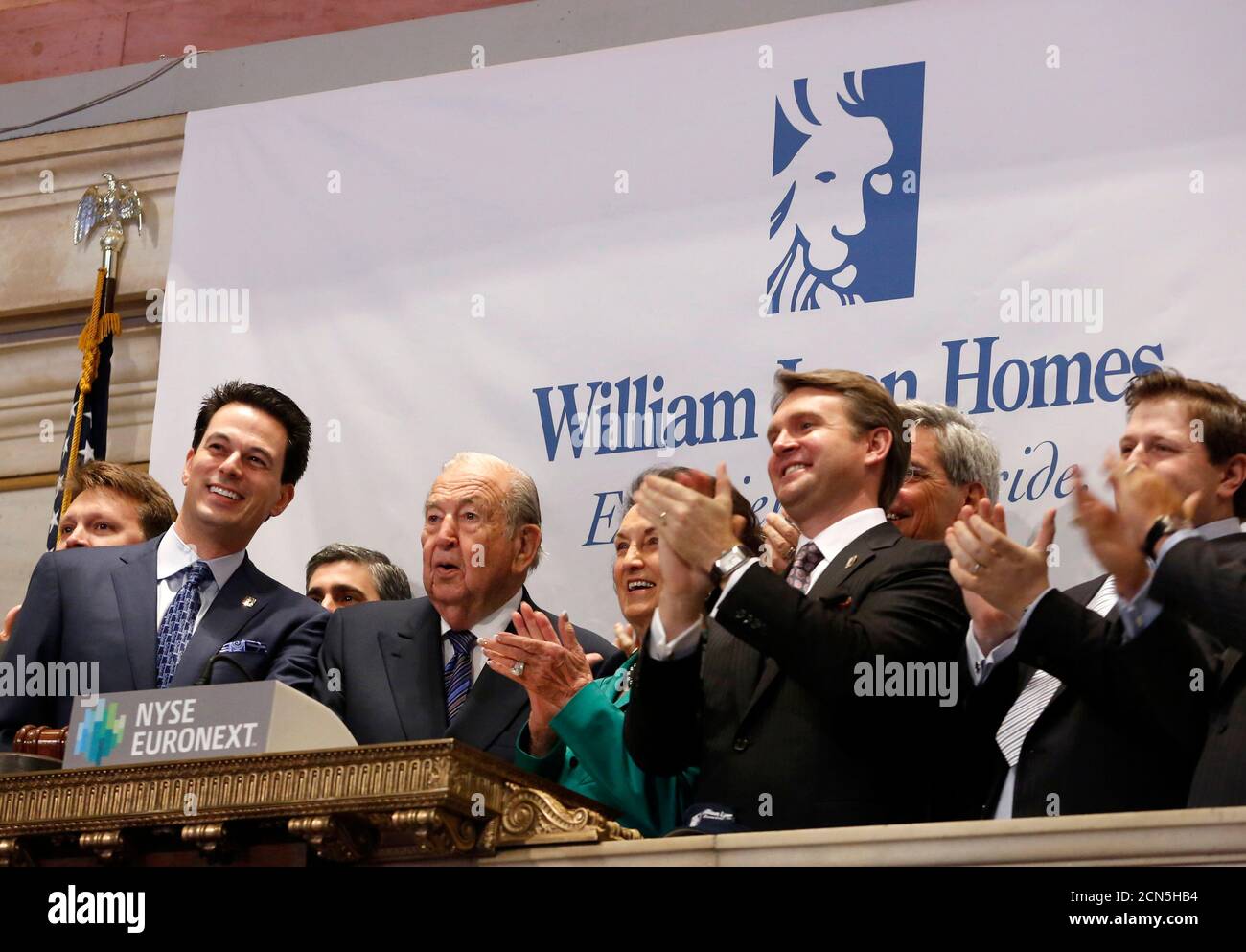 William Lyon Homes Inc. CEO William H. Lyons (L) and Gen. William Lyon (2nd-L) company founder, ring the opening bell at the New York Stock Exchange with company executives to celebrate their IPO, May 16, 2013.  William Lyon Homes Inc's shares opened 5 percent above their IPO price in their market debut, valuing the homebuilder at more than $800 million. The Newport Beach, California-based company is the third U.S. homebuilder to go public this year, seizing on investor appetite driven by a housing supply crunch, low interest rates and a recovering economy. Shares rose as much as 8 percent, or Stock Photo
