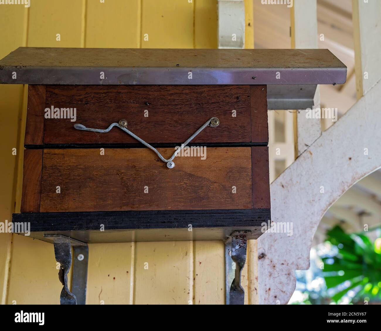 Timber and metal hive for Australian bees attached to the wall of an ...