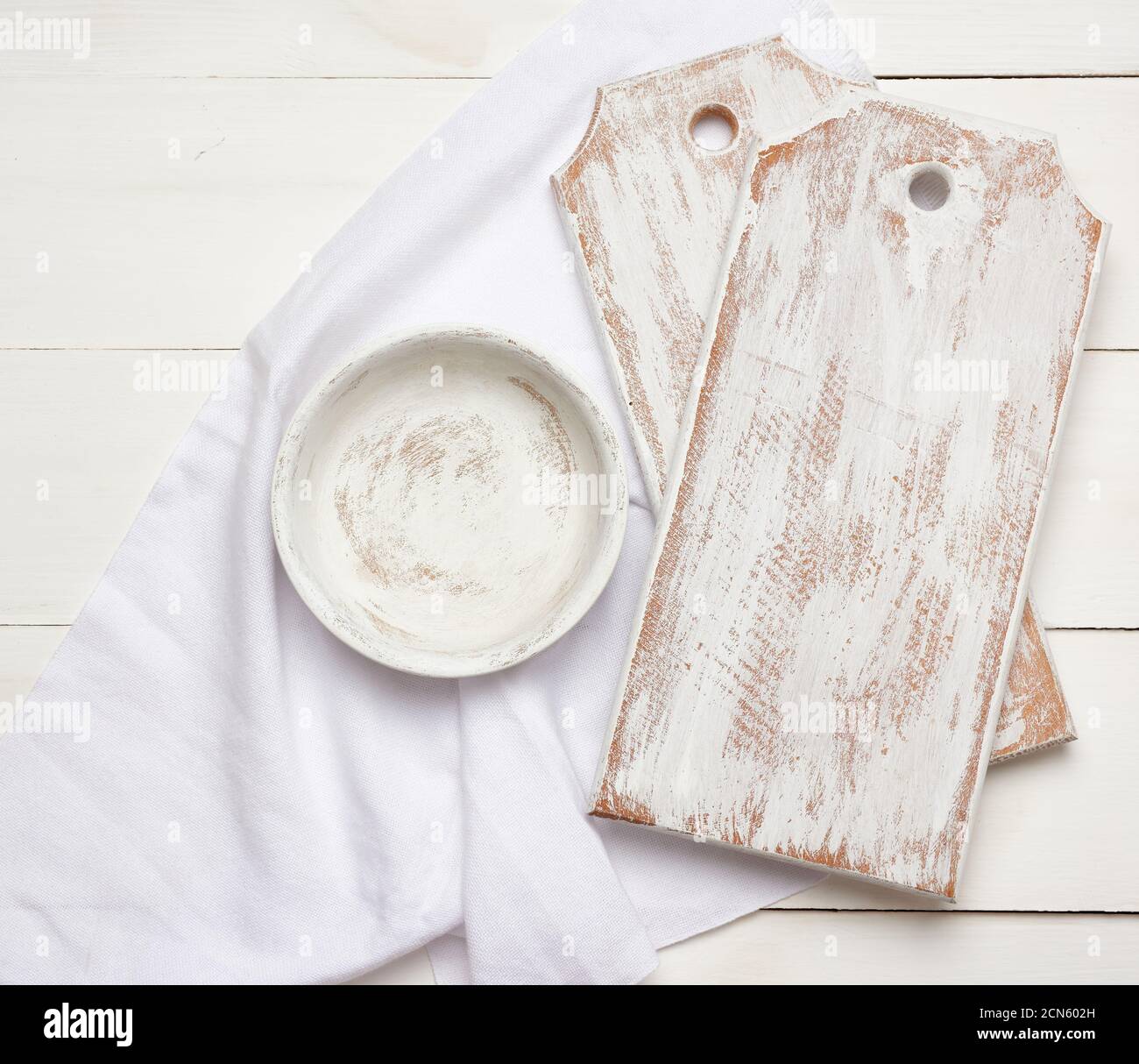 empty rectangular white cutting kitchen board and round plate on a wooden background Stock Photo