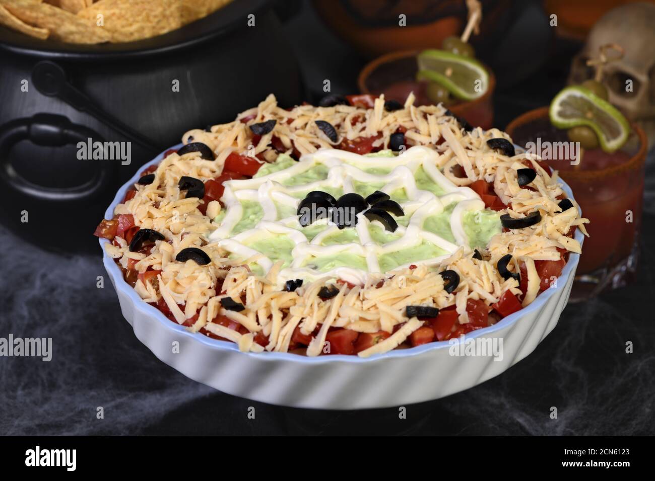 Spooky Halloween Seven Layer Taco Dip Turn a classic appetizer into a