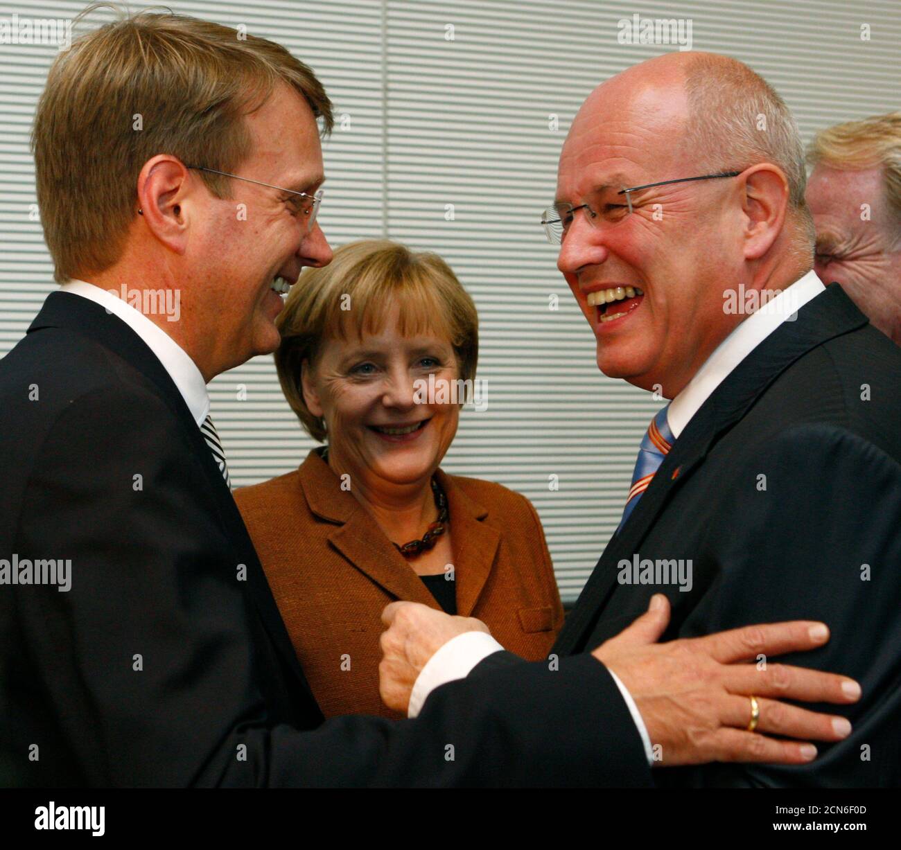General Secretary Ronald Pofalla, leader and German Chancellor Angela Merkel and Volker Kauder of the conservative Christian Democratic union (CDU) talk before a meeting of the CDU parliamentary group in Berlin September 29, 2009.  REUTERS/Thomas Peter (GERMANY) Stock Photo