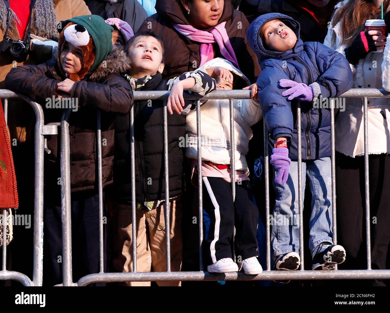 People watch as floats make their way through Times Square during the 85th annual Macy's Thanksgiving day parade in New York November 24, 2011. REUTERS/Shannon Stapleton (UNITED STATES - Tags: ENTERTAINMENT SOCIETY) Stock Photo