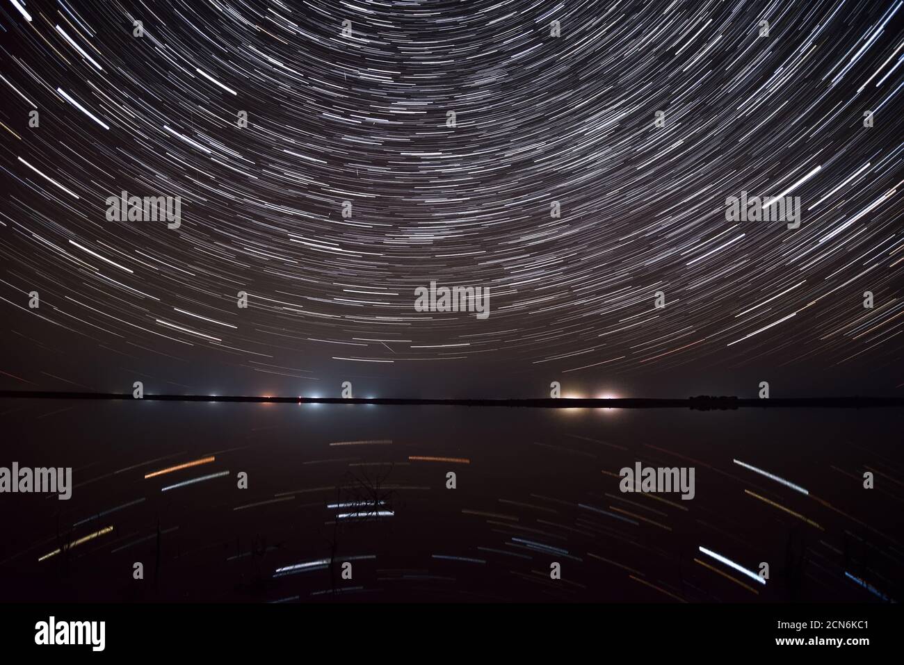 Amazing view of the night sky with stars in the form of circular tracks ...