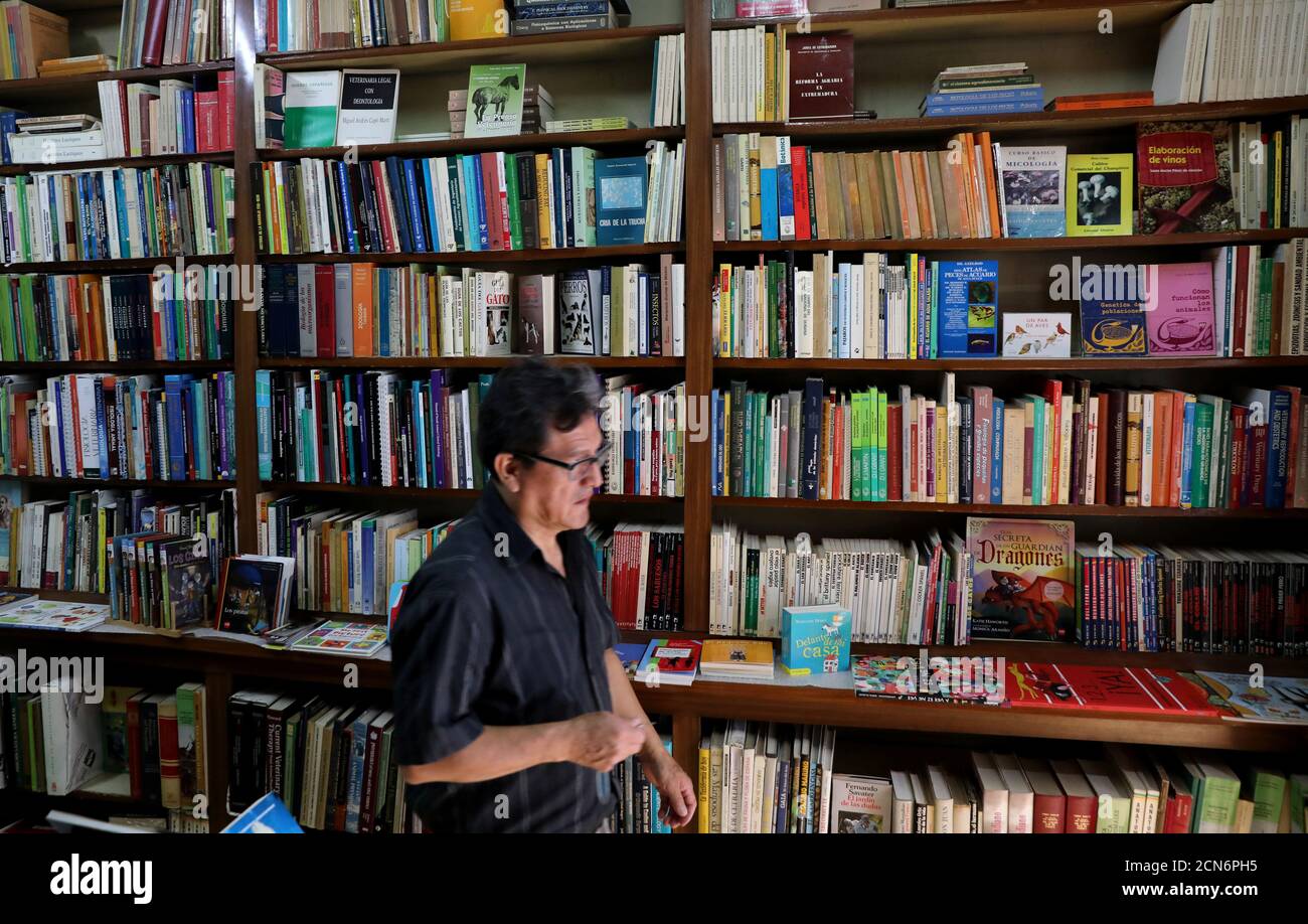 Employee Eduardo Valencia Walks Past Shelves With Medical Books Inside Madrid S Oldest Bookstore Libreria Nicolas Moya In Central Madrid Spain September 12 2018 Reuters Sergio Perez Stock Photo Alamy