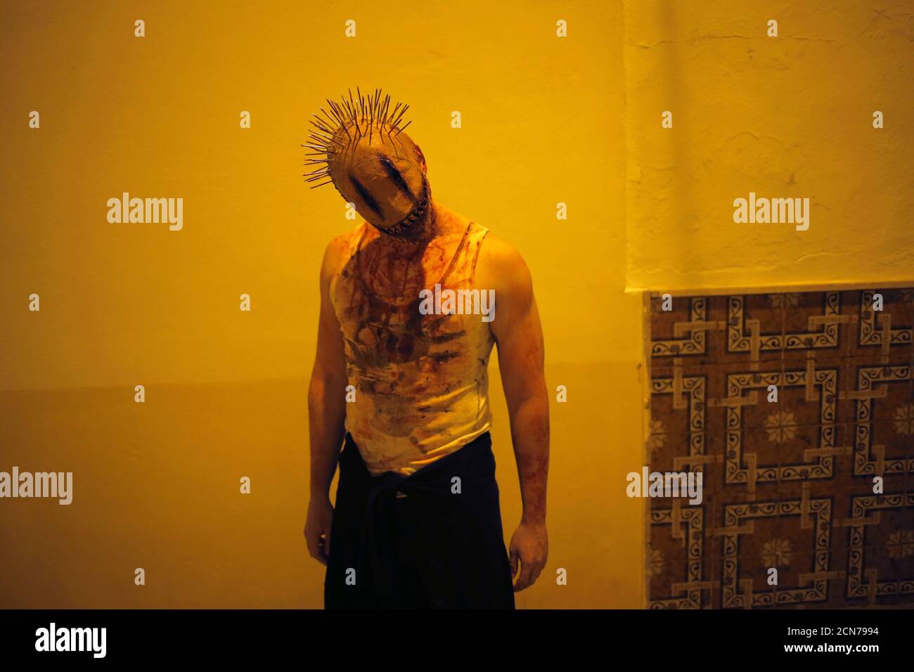 A Man Dressed Up As The Character Smiley From The Movie Smiley Poses For A Photo As He Takes Part In The Noche Del Terror Horror Night During Halloween Celebrations In The