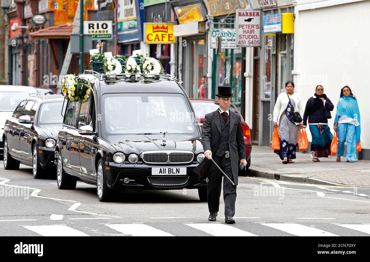 The funeral cortege of Lance Sergeant Dale McCallum of 1st Battalion Scots Guards arrives for his funeral at the New Testament Church of God in Willesden, London August 20, 2010. McCallum was killed in the conflict in Afghanistan on August 1.    REUTERS/Stefan Wermuth (BRITAIN - Tags: MILITARY CONFLICT) Stock Photo