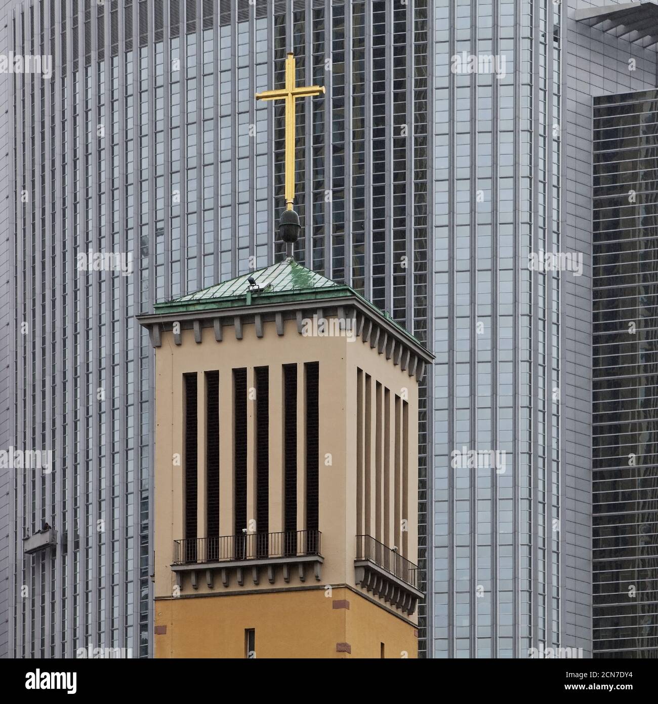 Old bell tower of the Matthaeus church in front of the modern Pollux office, Frankfurt, Germany Stock Photo