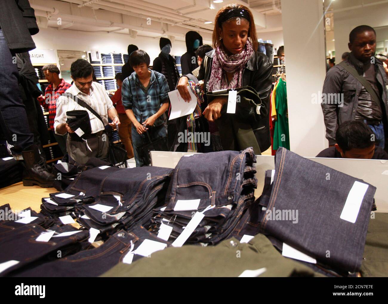 People shop at the Uniqlo store during the Black Friday sales event at  Roosevelt Field Mall in Garden City, New York, U.S., November 29, 2019.  REUTERS/Shannon Stapleton Stock Photo - Alamy