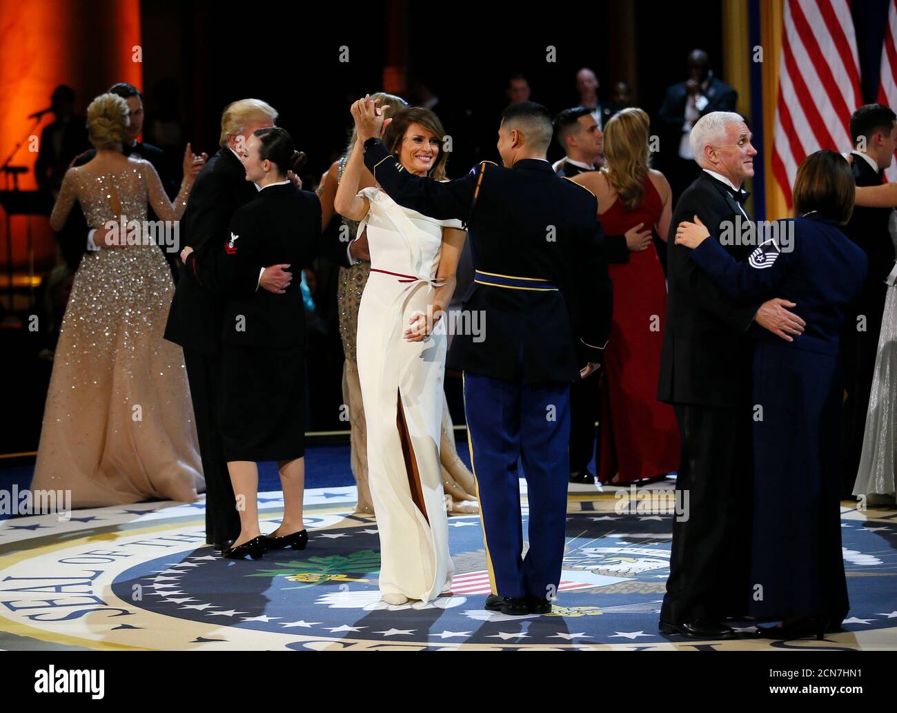 United States Army Staff Sergeant Jose A. Medina dances with U.S. first lady Melania Trump (C) during the 'Salute to Our Armed Services Ball' on Inauguration Day in Washington, D.C, U.S. January 20, 2017.   REUTERS/Rick Wilking Stock Photo