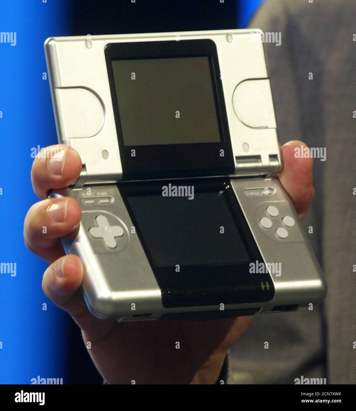 The new Nintendo DS, a dual screen portable gaming device is displayed for  the first time by Reggie Fils-Amime, Nintendo of America executive vice  president, during a press preview of Nintendo hardware