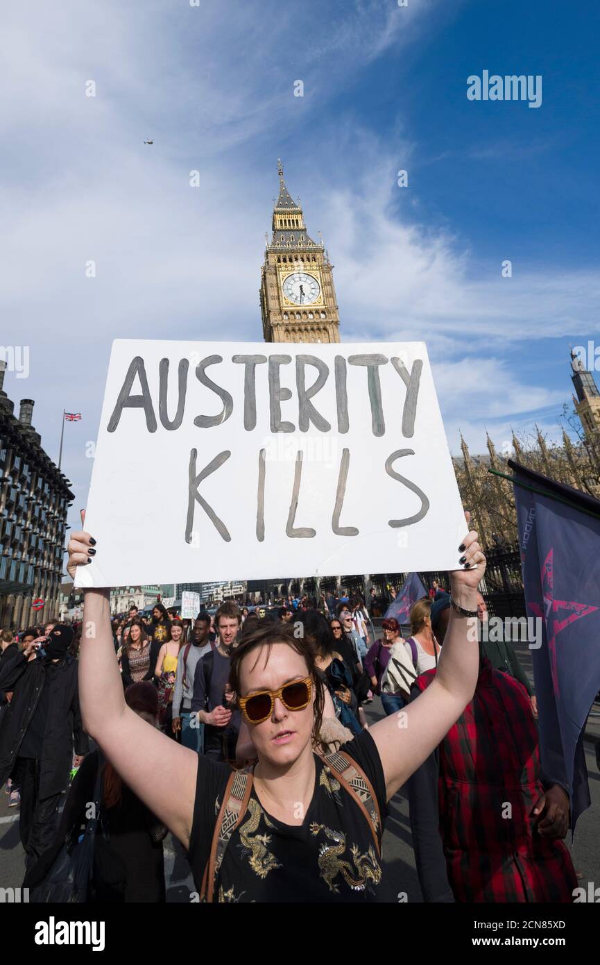 A anti austerity demonstrators, protesting against the new Conservative Government and their austerity policy, Parliament Square, Westminster, London, UK.  9 May 2015 Stock Photo