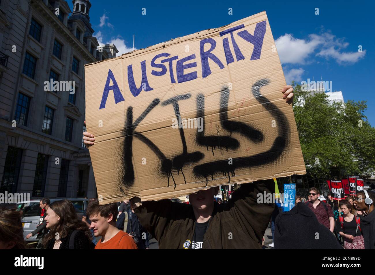 A anti austerity demonstrators, protesting against the new Conservative Government and their austerity policy, Pall Mall, Westminster, London, UK.  9 May 2015 Stock Photo