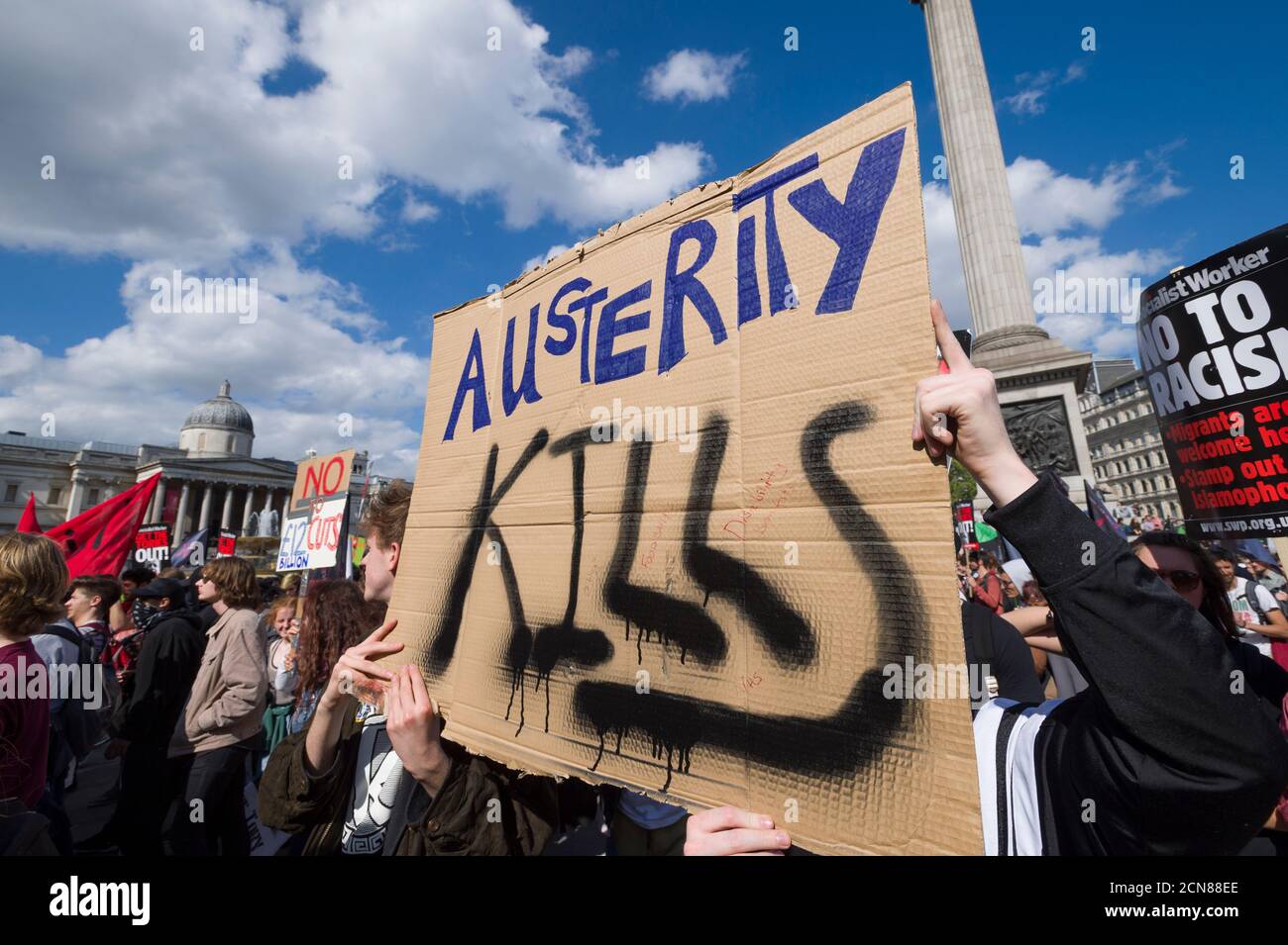 A anti austerity demonstrators, protesting against the new Conservative Government and their austerity policy, Trafalgar Square, Westminster, London, UK.  9 May 2015 Stock Photo