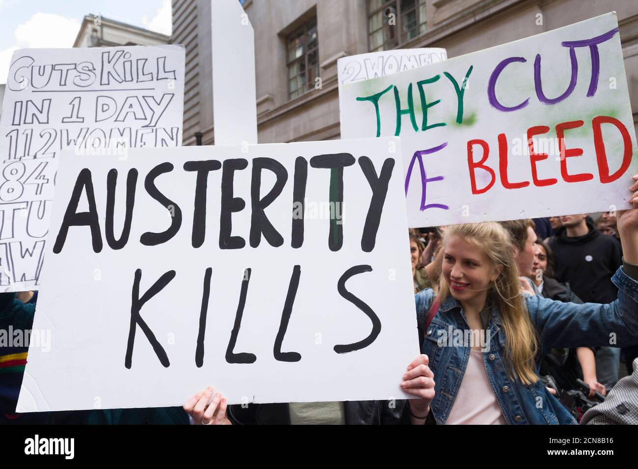 A anti austerity demonstrators, protesting against the new Conservative Government and their austerity policy outside, Conservative Campaign Headquarters, Matthew Parker Street, Westminster, London, UK.  9 May 2015 Stock Photo