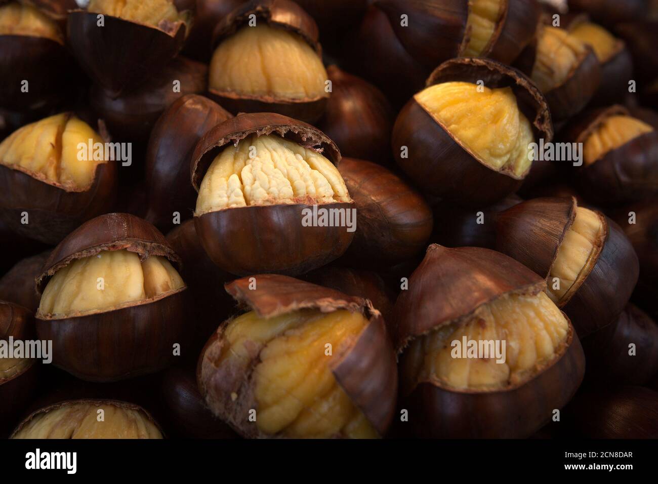 A street vendor's chestnuts are pictured as they roast in front of the