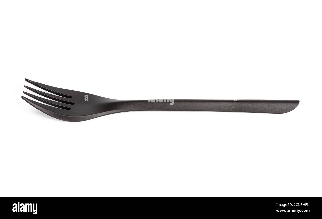 disposable black plastic fork isolated on white background Stock Photo