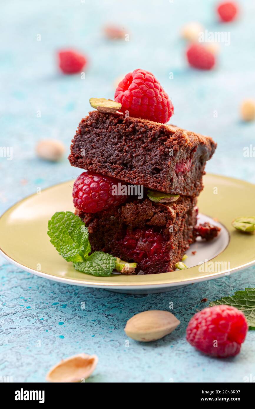 Traditional brownies with raspberries. Stock Photo