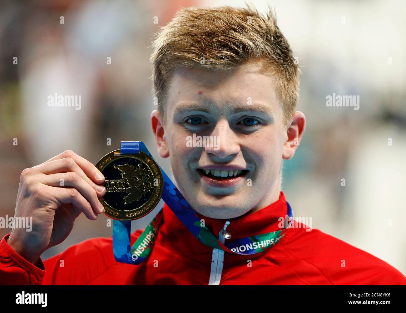 Adam Peaty of Britain poses with his gold medal after the men's 50m breaststroke final at the Aquatics World Championships in Kazan, Russia, August 5, 2015.   REUTERS/Stefan Wermuth/File photo Stock Photo