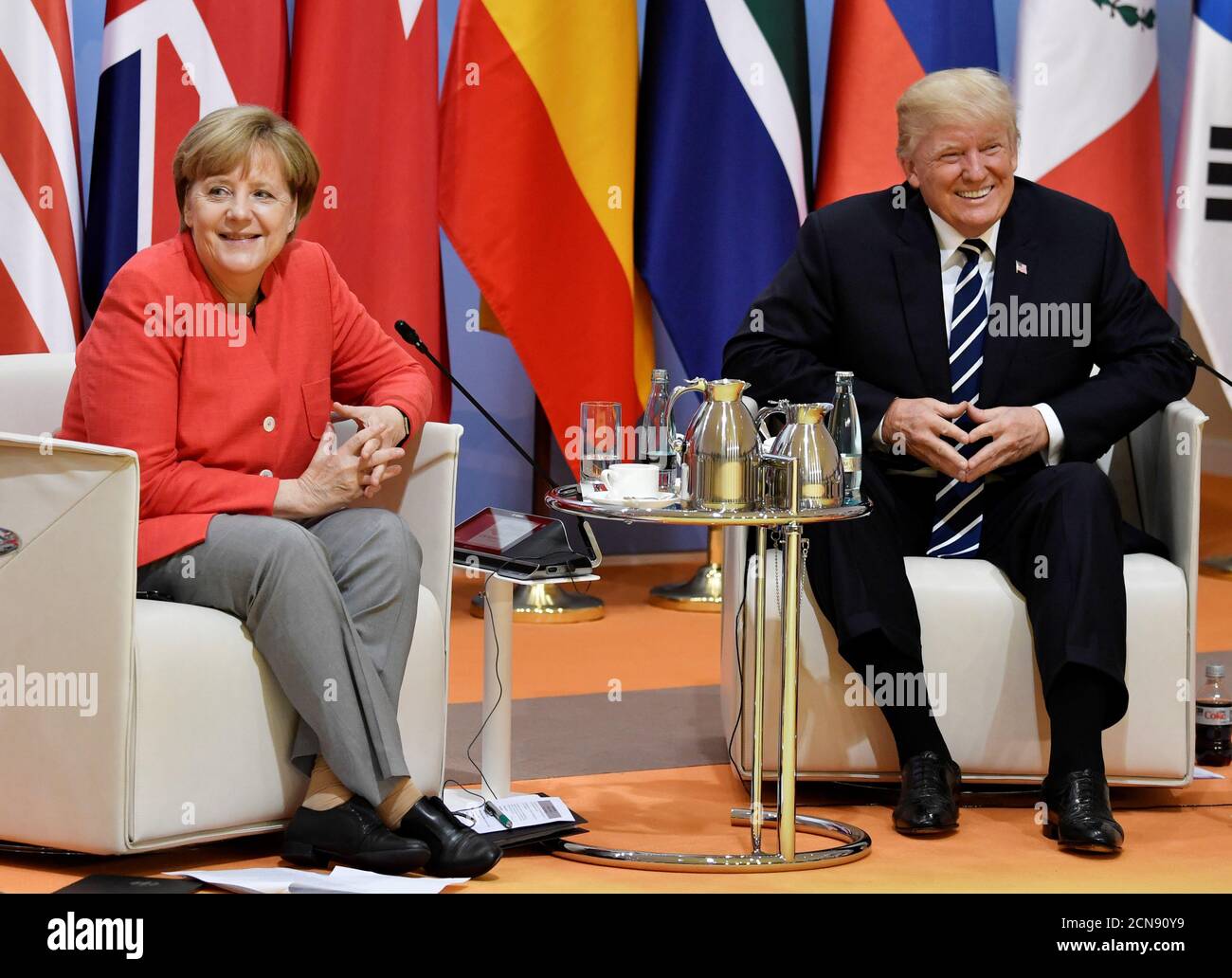 German Chancellor Angela Merkel and US President Donald Trump meet at the start of the 'retreat meeting' on the first day of the G20 summit in Hamburg, Germany, July 7, 2017. REUTERS/John MACDOUGALL,POOL Stock Photo
