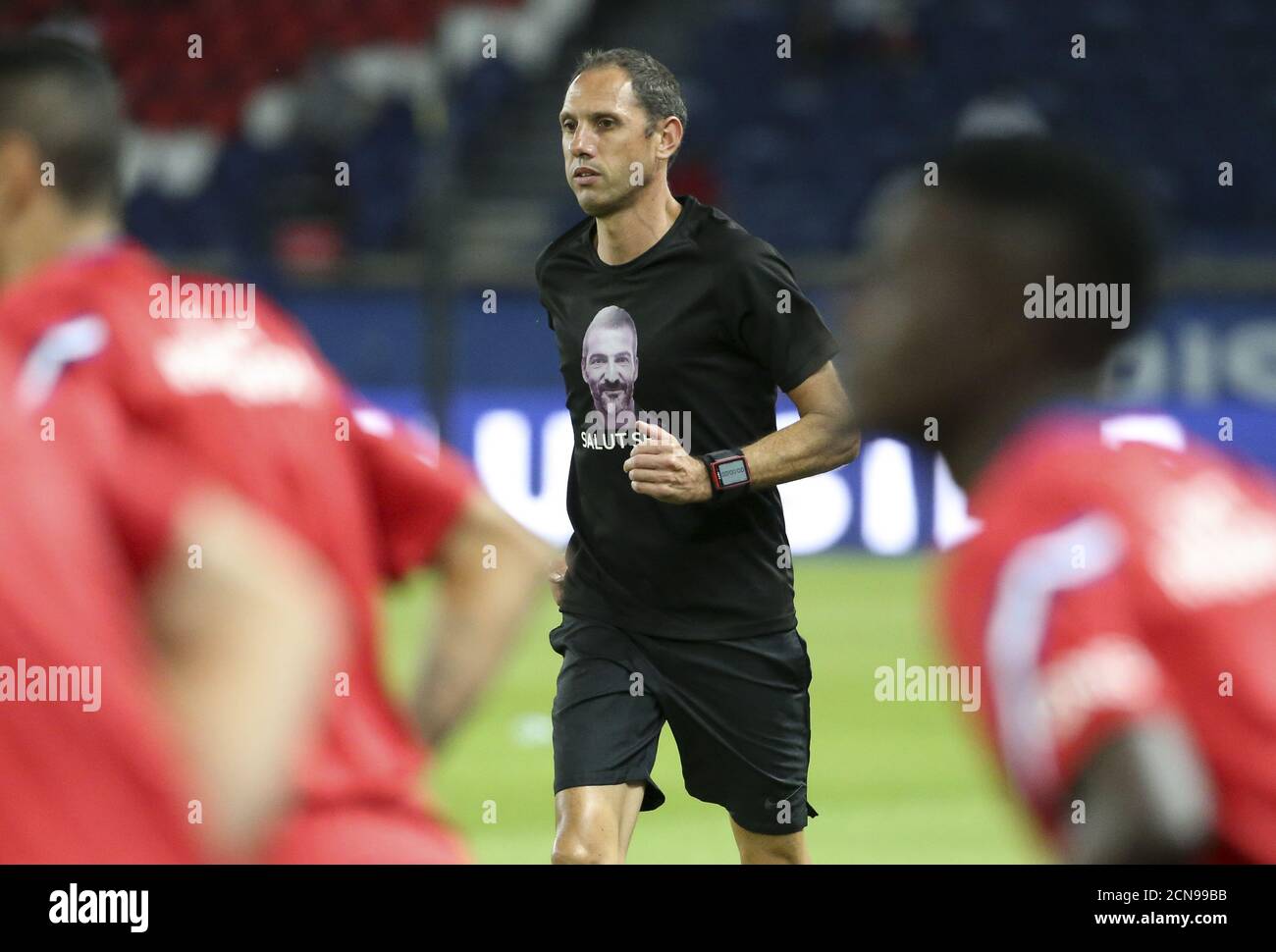 Referee Mikael Lesage wearing a t-shirt paying homage to deceased referee Sebastien Desiage during the warm up before the French championship Ligue 1 Stock Photo