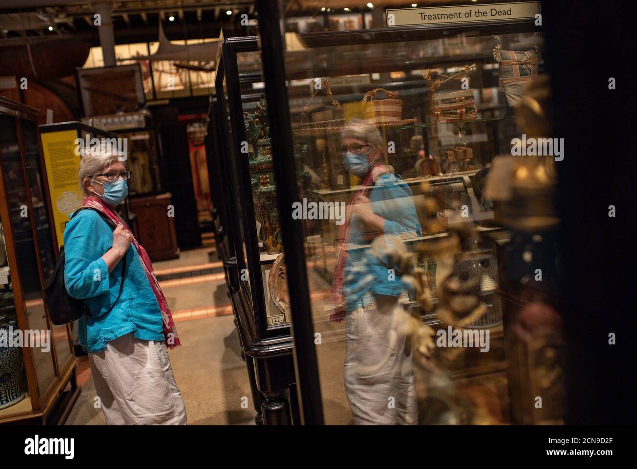 Visitors wearing PPE during preview opening day of the Pitt Rivers Museum, in Oxford. The Museum displays archaeological and ethnographic objects from all parts of the world, which visitors are now able to view once more after the museum was closed due to the coronavirus pandemic. Stock Photo