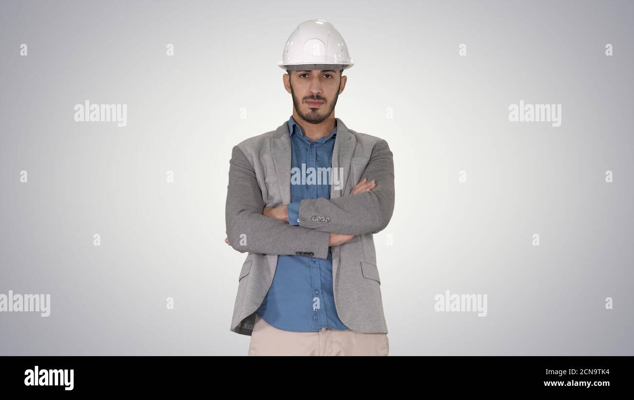 Confident construction engineer architect young man in helmet wi Stock Photo