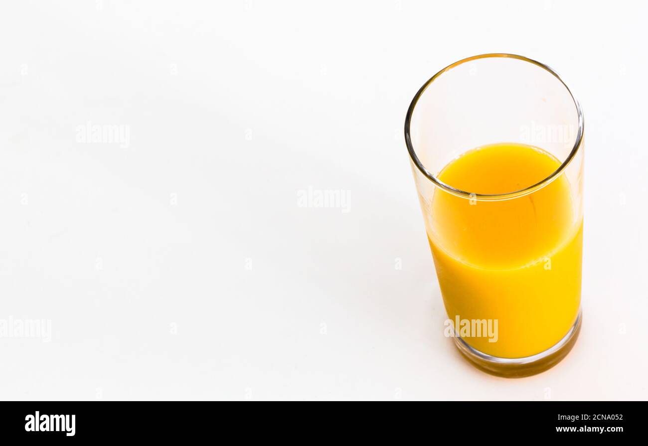 Glass of fresh orange juice isolated on white background. Vitamin C. Copy space. Stock Photo