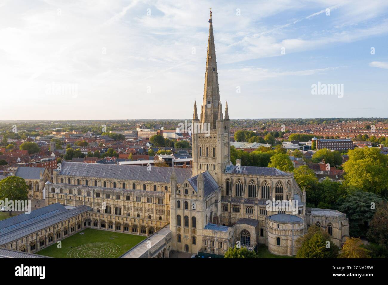 A view of Norwich Cathedral as the weathercock is reinstalled at the top of the spire after it was re-gilded as part of the restoration work on the spire which stands at over 312ft high. Stock Photo