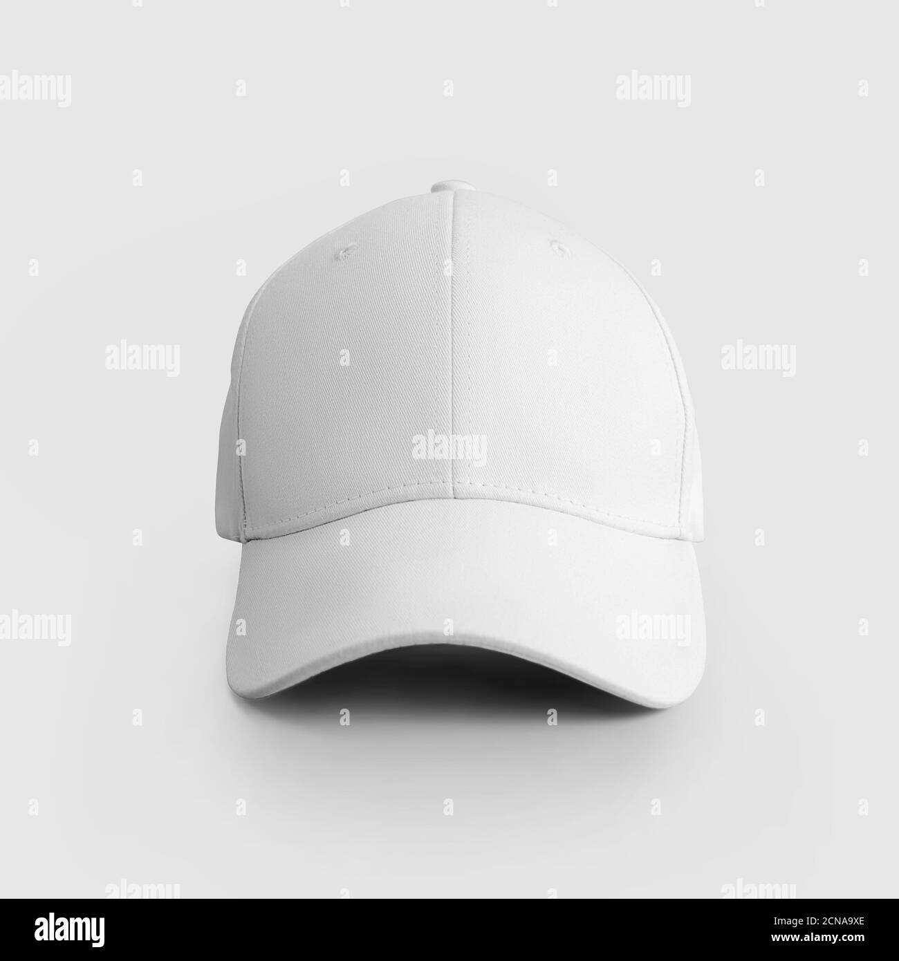Mockup white baseball cap close up isolated on background, hat for design presentation. Visor template, front view, blank clothing accessory. Universa Stock Photo