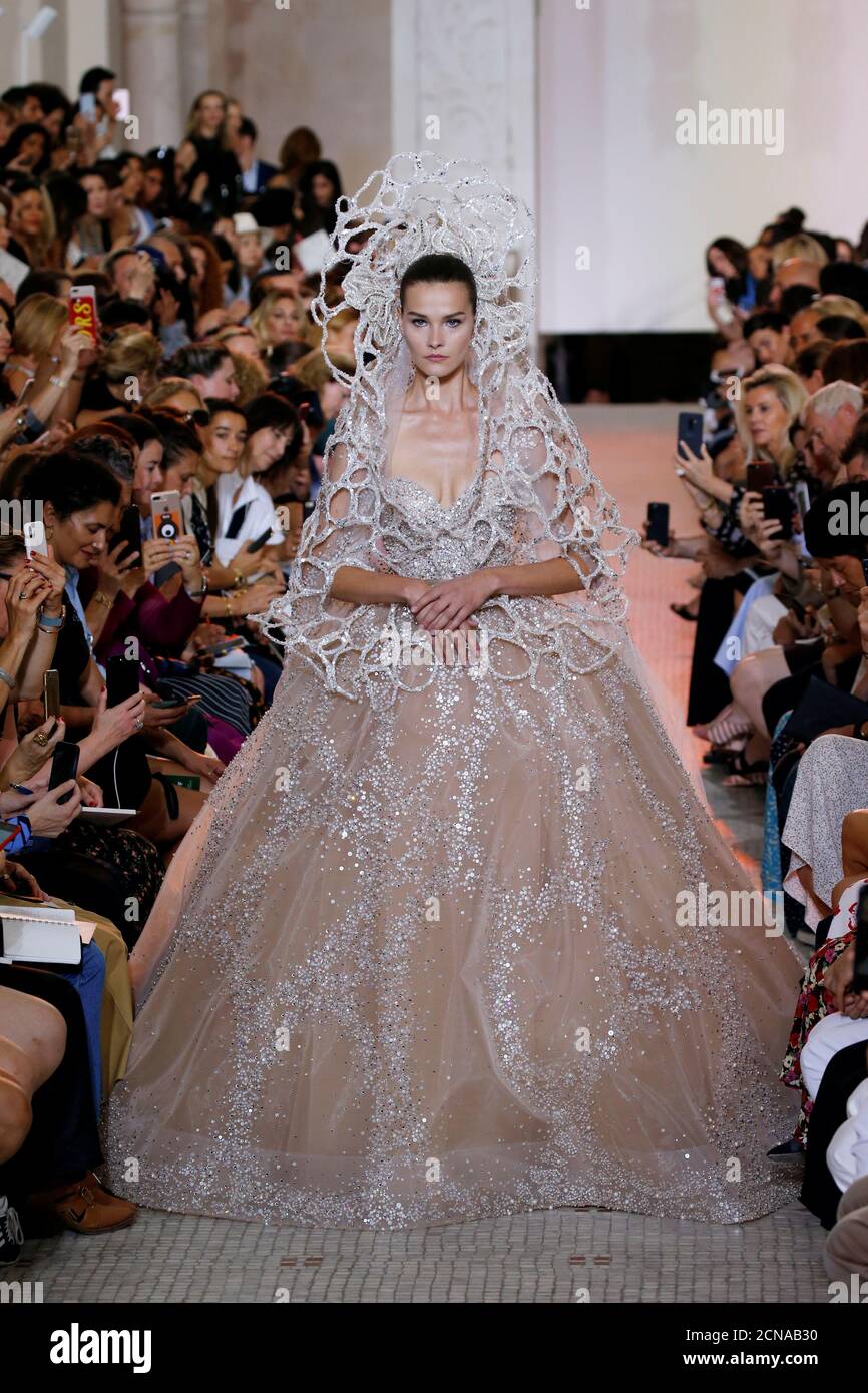 A model presents a wedding dress by designer Elie Saab as part of his Haute  Couture Fall/Winter 2018/2019 fashion show in Paris, France, July 4, 2018.  REUTERS/Regis Duvignau Stock Photo - Alamy
