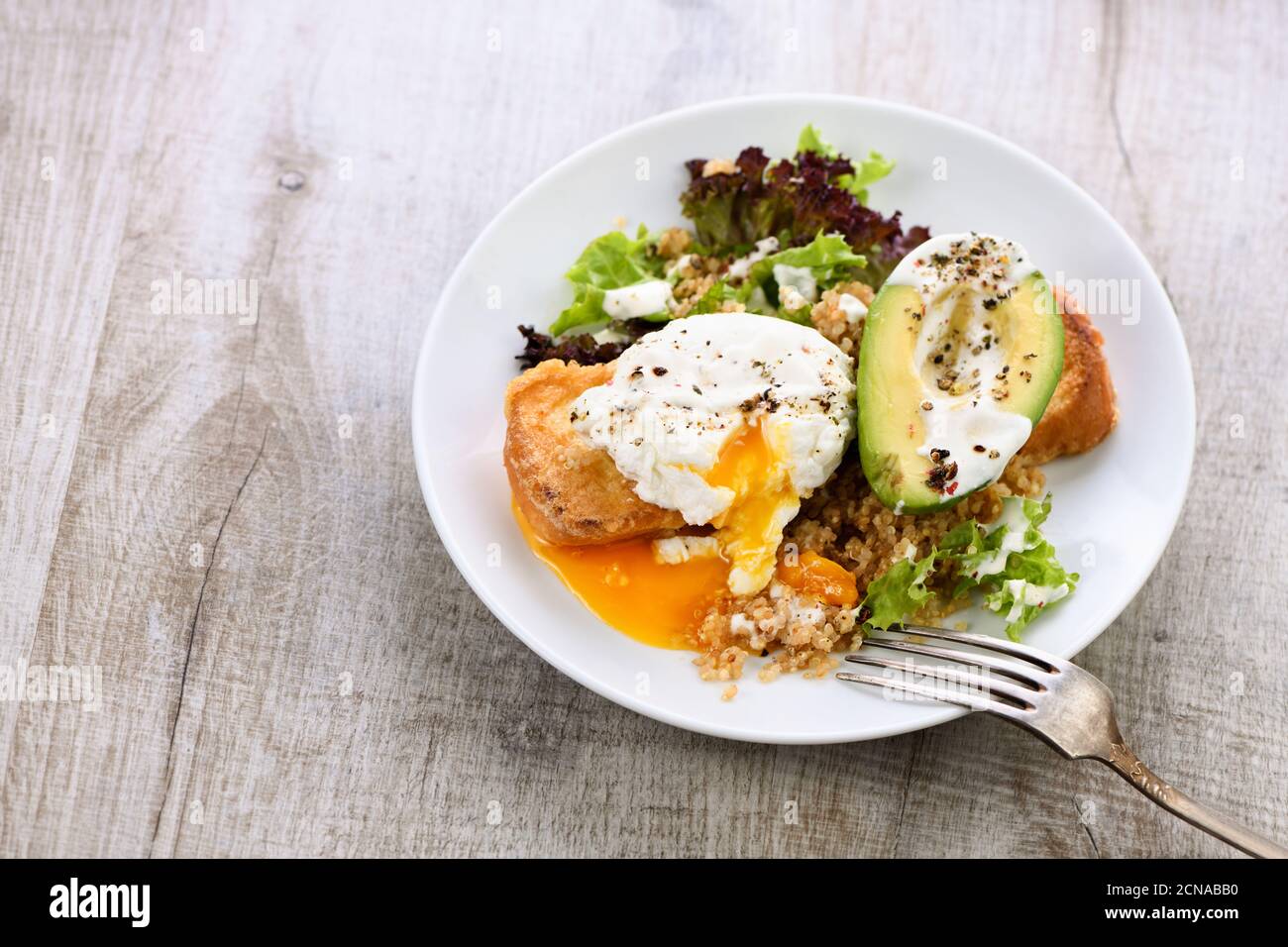 A healthy and balanced breakfast plate. Benedict's egg spreads on a
