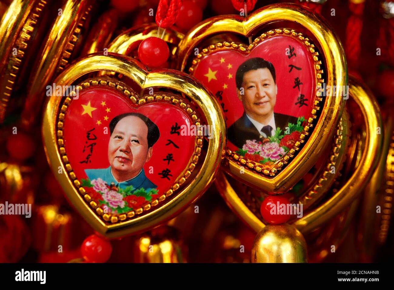 Souvenirs featuring portraits of China's late Chairman Mao Zedong and China's President Xi Jinping are seen at a shop near the Forbidden City in Beijing, China, September 9, 2016. REUTERS/Thomas Peter     TPX IMAGES OF THE DAY Stock Photo