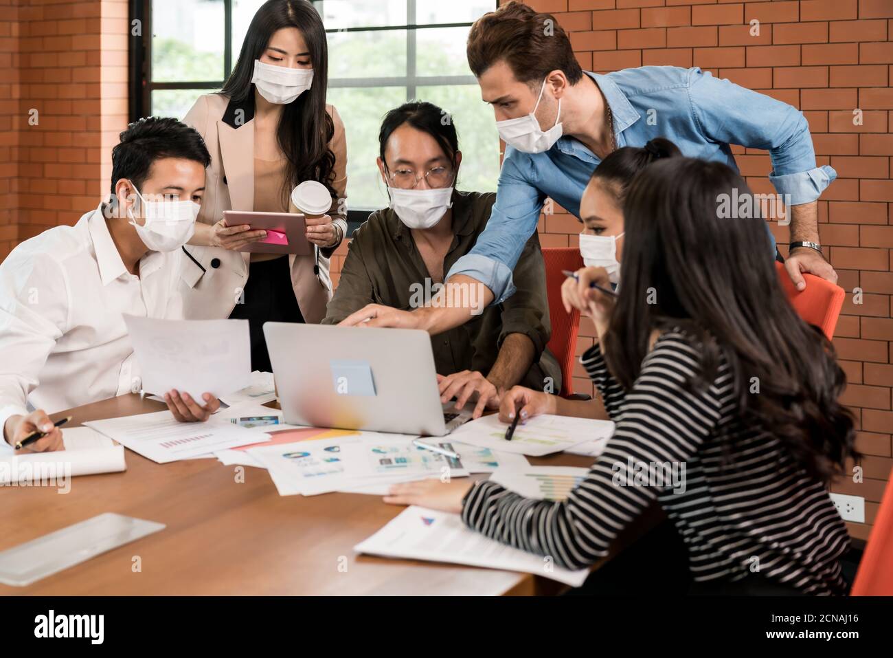 Business person brainstorm in meeting room with face mask Stock Photo ...