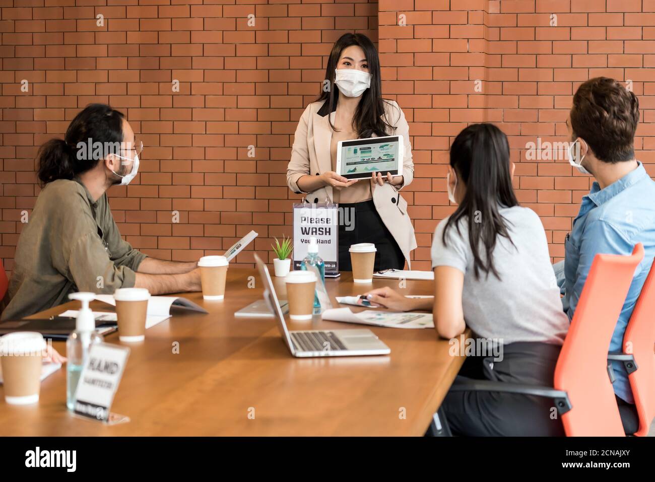 Businee person meeting with face mask. Stock Photo
