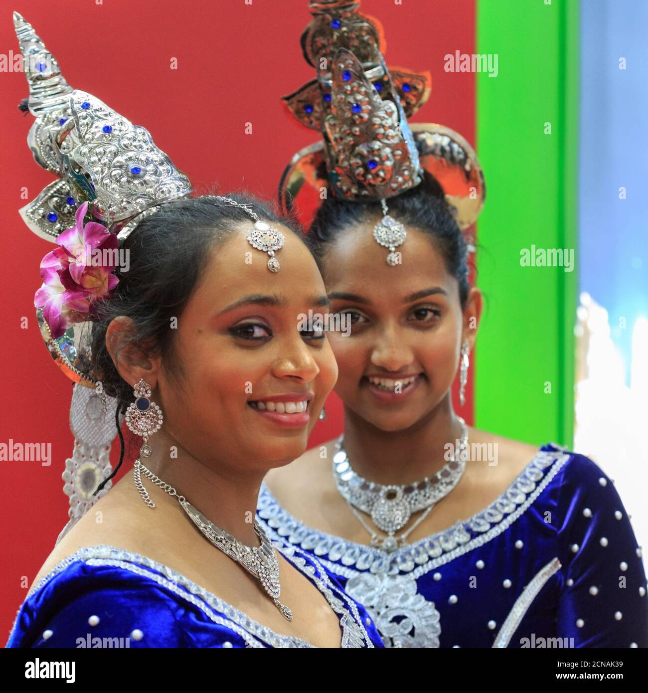 Asian female performers in traditional Sri Lankan dresses, World Travel Market (WTM) trade show, ExCel London, UK Stock Photo