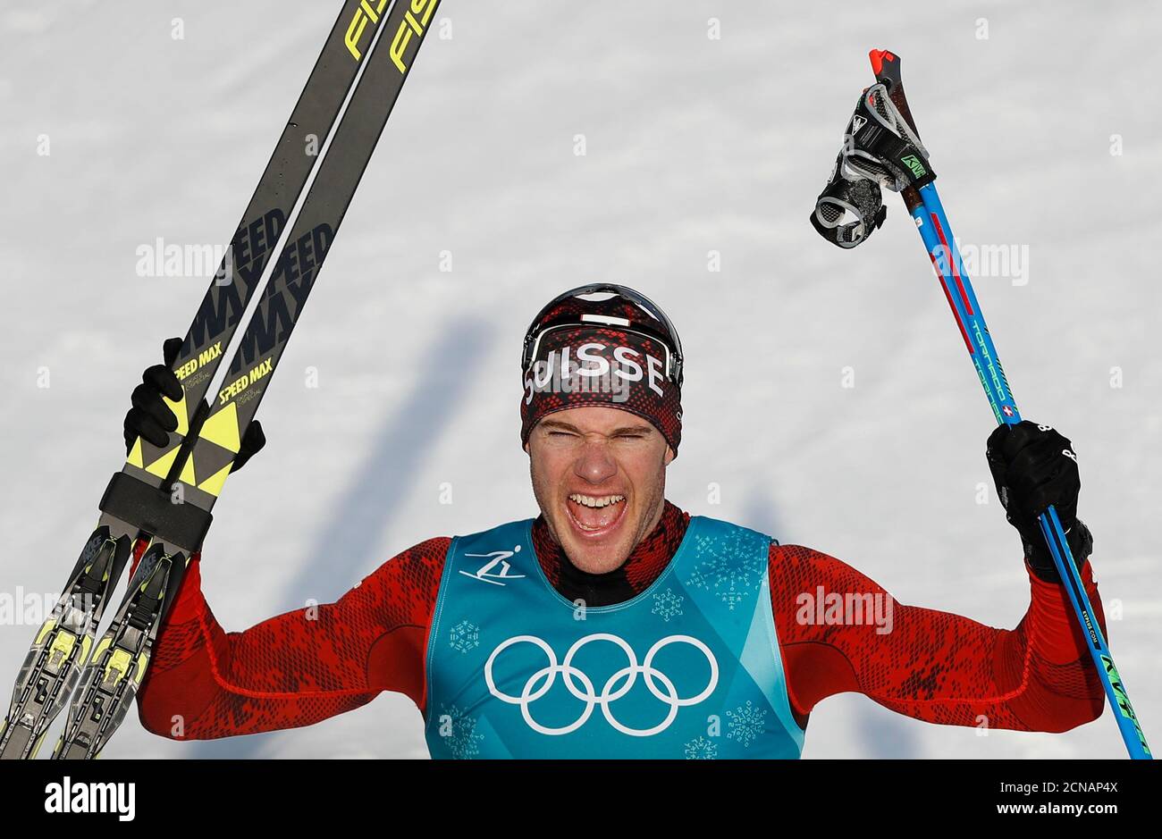 Cross-Country Skiing - Pyeongchang 2018 Winter Olympics - Men’s 15km Free - Alpensia Cross-Country Skiing Centre - Pyeongchang, South Korea - February 16, 2018 - Dario Cologna of Switzerland reacts after crossing the finish line. REUTERS/Murad Sezer Stock Photo