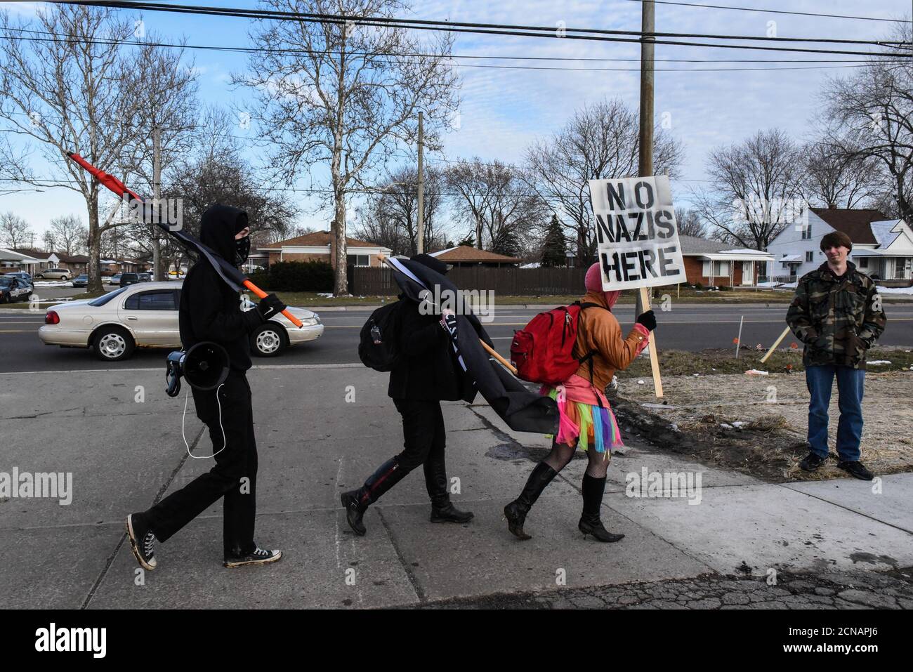 Members of the Great Lakes anti-fascist organization (Antifa) protest against the Alt-right outside a hotel in Warren, Michigan, U.S., March 4, 2018. REUTERS/Stephanie Keith Stock Photo
