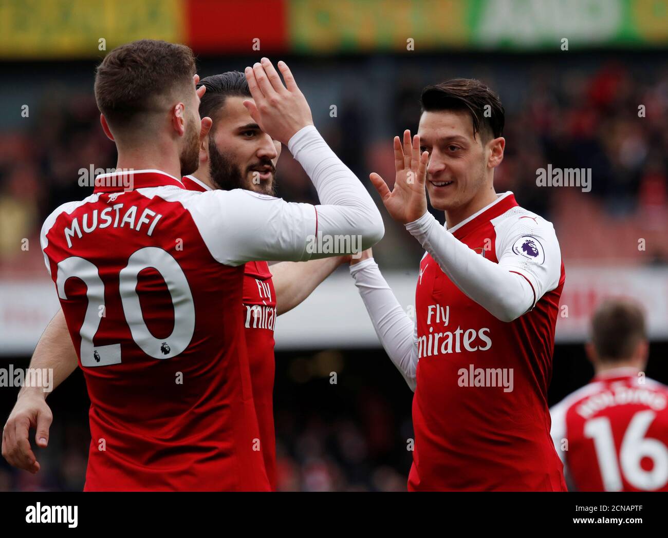Soccer Football - Premier League - Arsenal vs Watford - Emirates Stadium, London, Britain - March 11, 2018   Arsenal's Shkodran Mustafi celebrates scoring their first goal with team mates         REUTERS/Eddie Keogh    EDITORIAL USE ONLY. No use with unauthorized audio, video, data, fixture lists, club/league logos or 'live' services. Online in-match use limited to 75 images, no video emulation. No use in betting, games or single club/league/player publications.  Please contact your account representative for further details. Stock Photo