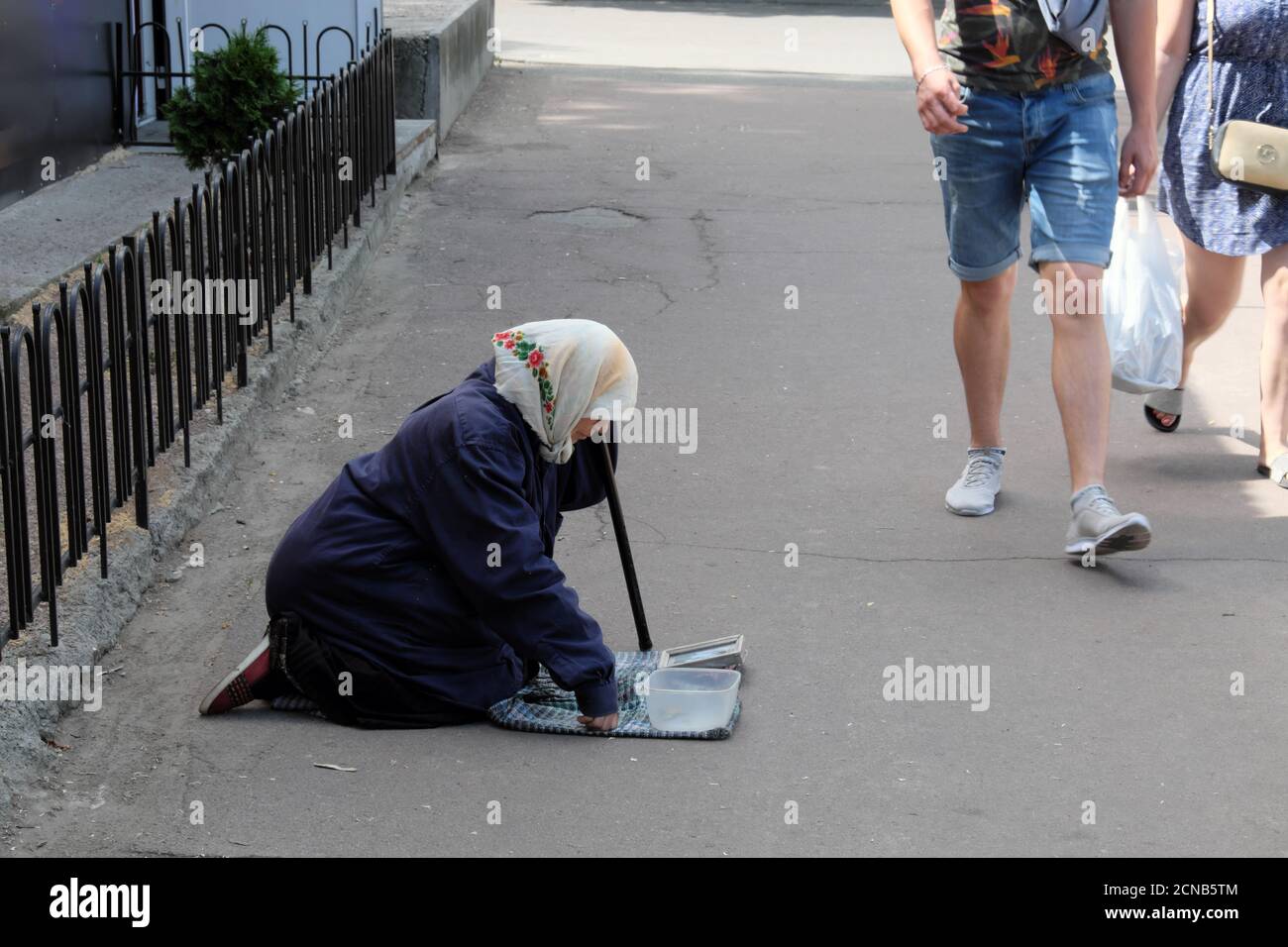 Elderly woman kneeling hi-res stock photography and images - Alamy