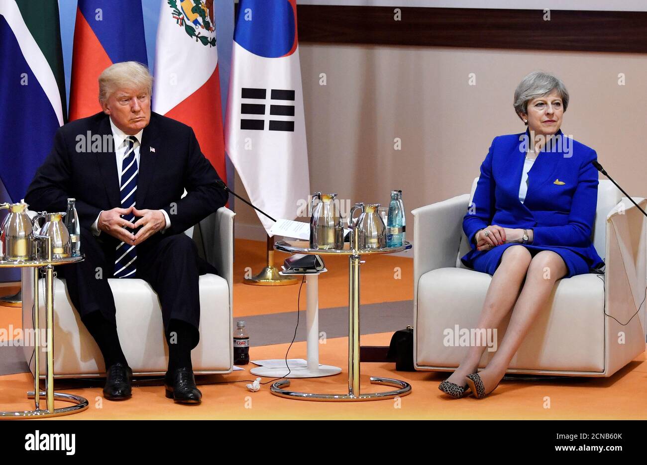 US President Donald Trump and Britain's Prime Minister Theresa May meet at the start of the 'retreat meeting' on the first day of the G20 summit in Hamburg, Germany, July 7, 2017. REUTERS/John MACDOUGALL,POOL Stock Photo